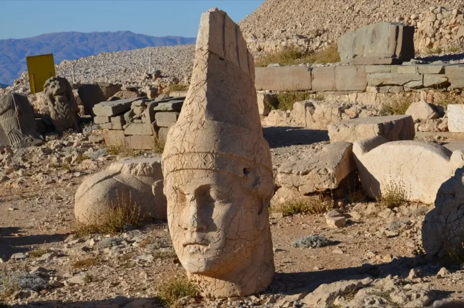 Giant stone head statues at Mount Nemrut at sunrise